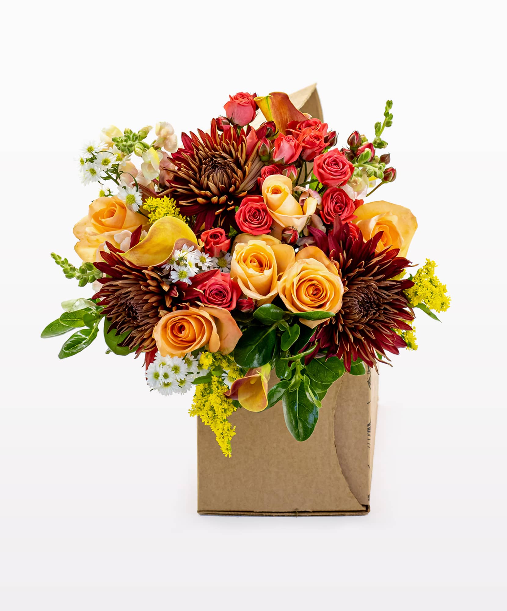 Vibrant autumn bouquet with roses, chrysanthemums, and seasonal greens in a box.